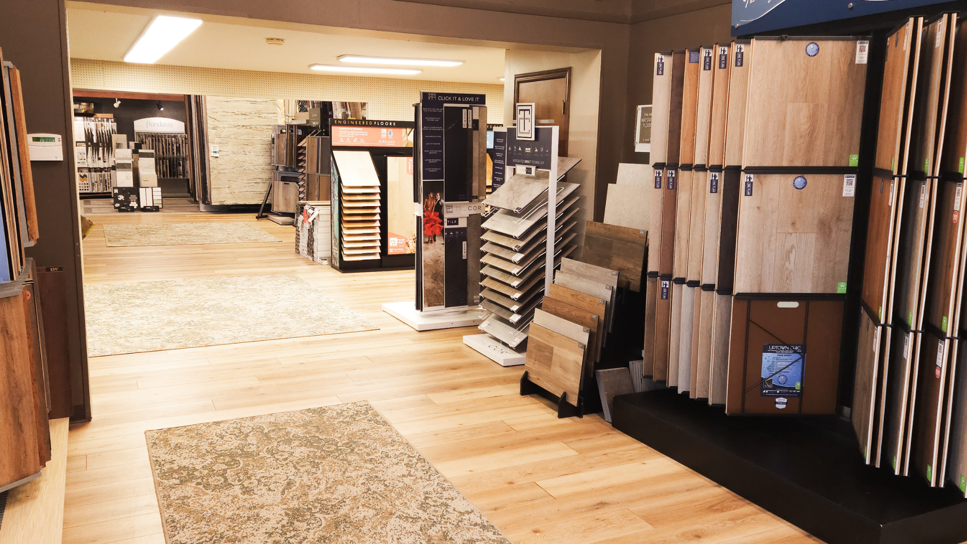 Flooring showroom in Mansfield OH with hardwood, carpet, and tile displays at Washington's Carpet One Floor & Home